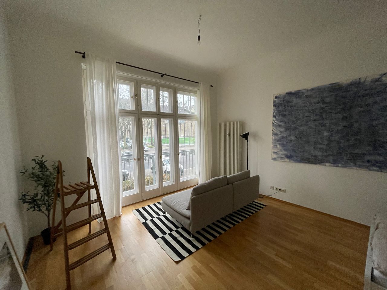 Sunny 1-bedroom apartment/studio with high ceilings and French balcony in Friedenau