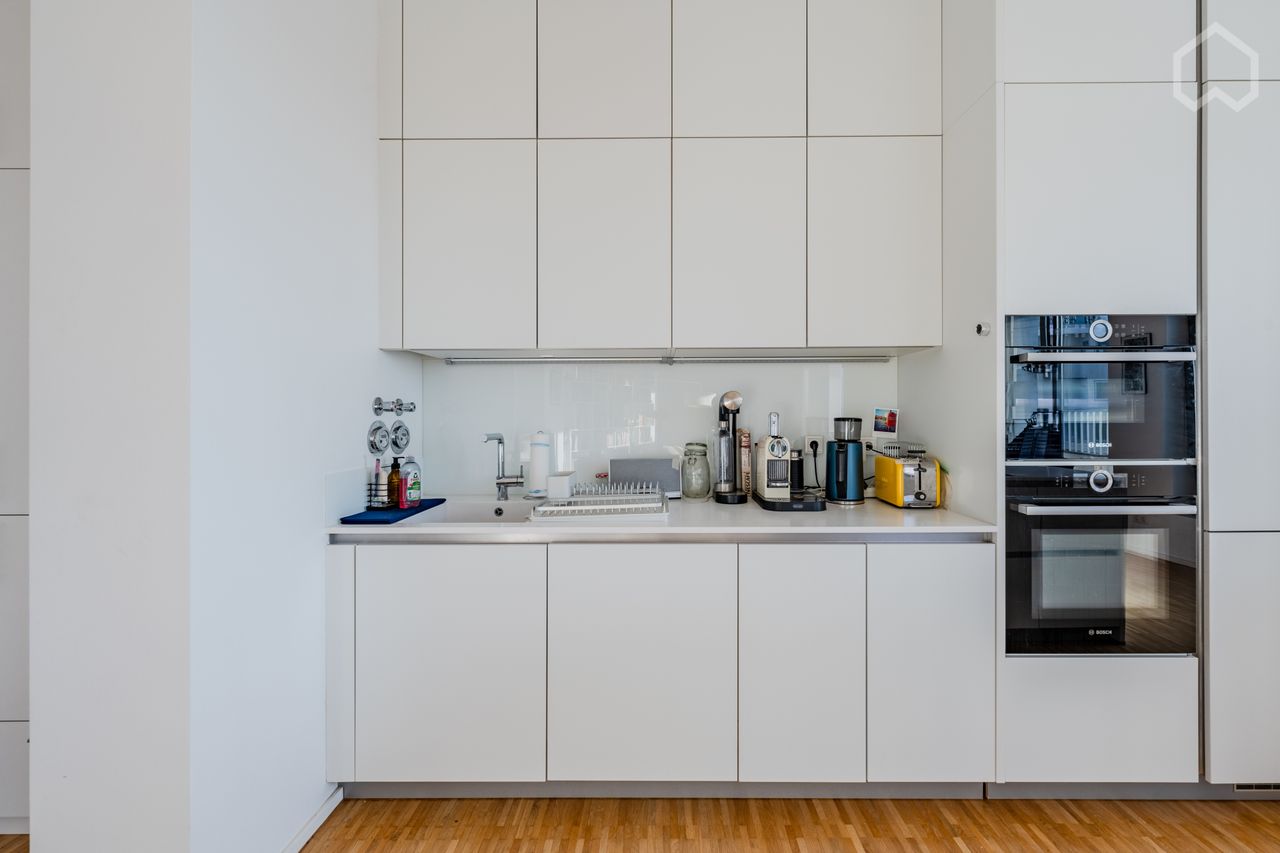 Spacious Penthouse Living with Stunning Terrace Views in Mitte