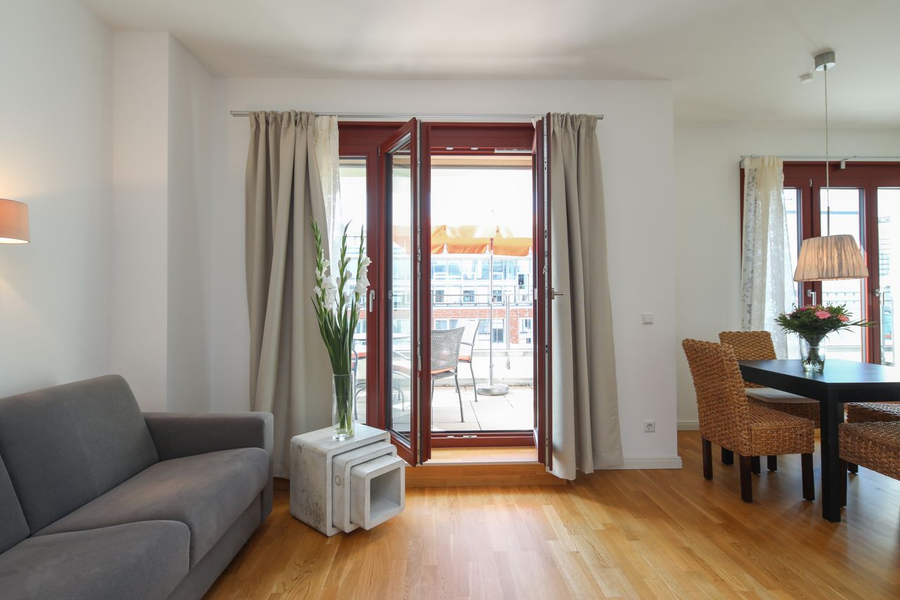 Sunny and modern 2-room penthouse in Berlin Mitte with roof terrace and underground parking space