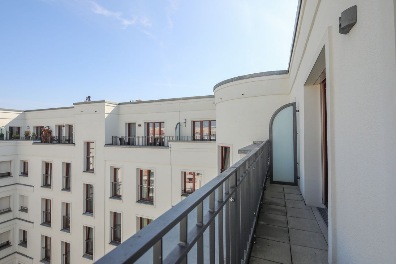 Sunny and modern 2-room penthouse in Berlin Mitte with roof terrace and underground parking space