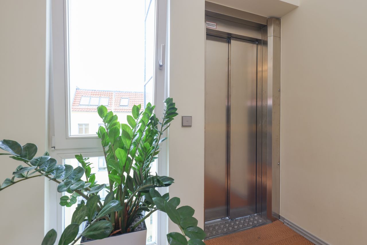 Great 2 room attic-business-apartment with a southwest facing balcony and viewing to the Alexander Tower at Kollwitzplatz