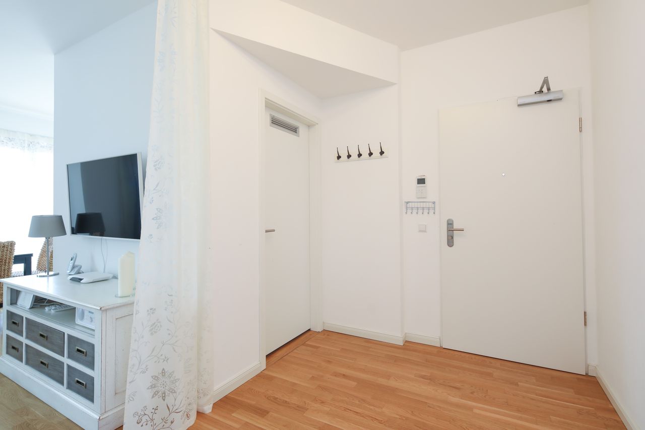 Sunny and modern 2-room penthouse in Berlin Mitte with roof terrace and underground parking space