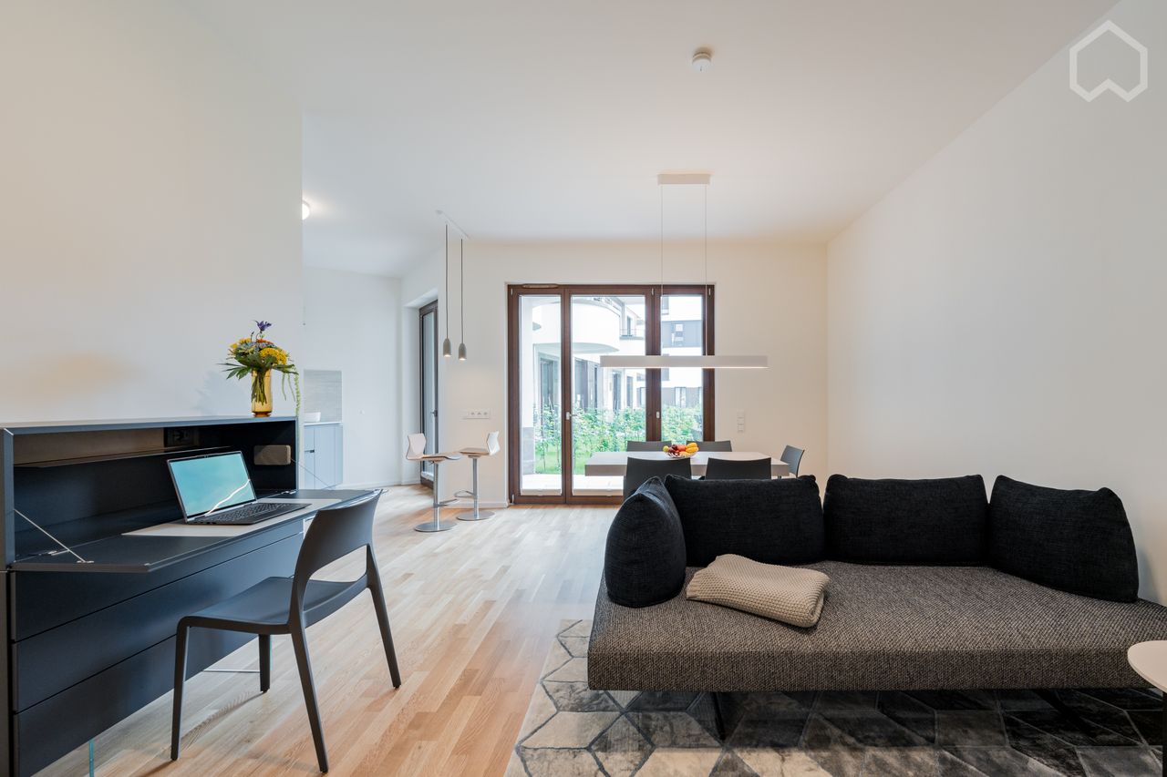 Luxurious living directly on the Spree: Modern 2-room apartment in Berlin Charlottenburg with partially covered terrace and spacious garden