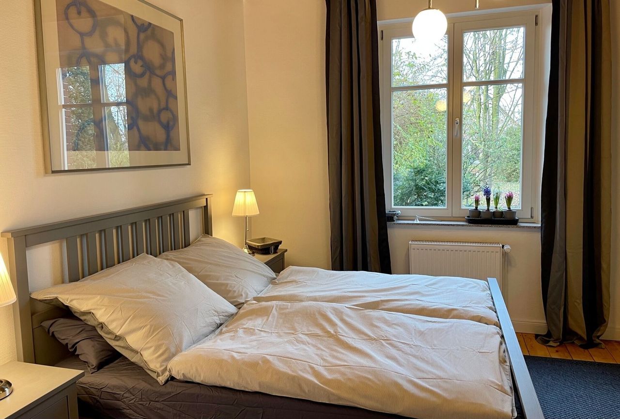 Furnished apartment with garden use and parking space