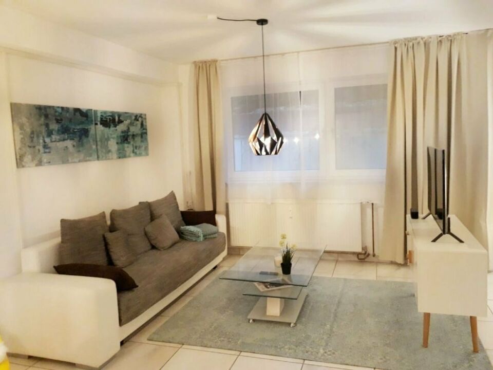 Near BionTech, University Hospital + KKM: Modernly furnished apartment with garden and sauna