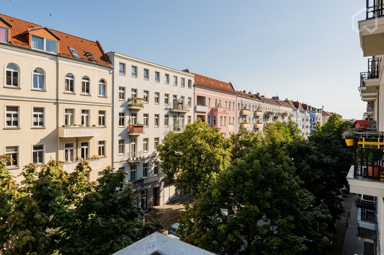 Hi ceilinged, sun-drenched 4-room corner apartment overlooking Petersburger Platz in Friedrichshain