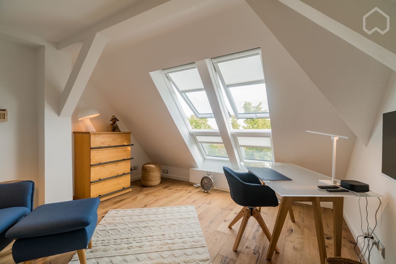 Light-flooded, modern two-room apartment in the developed attic of an early 20th century house