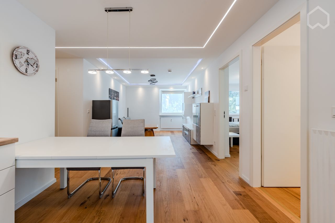 huge master bedroom with private balcony and working station in a high-end apartment