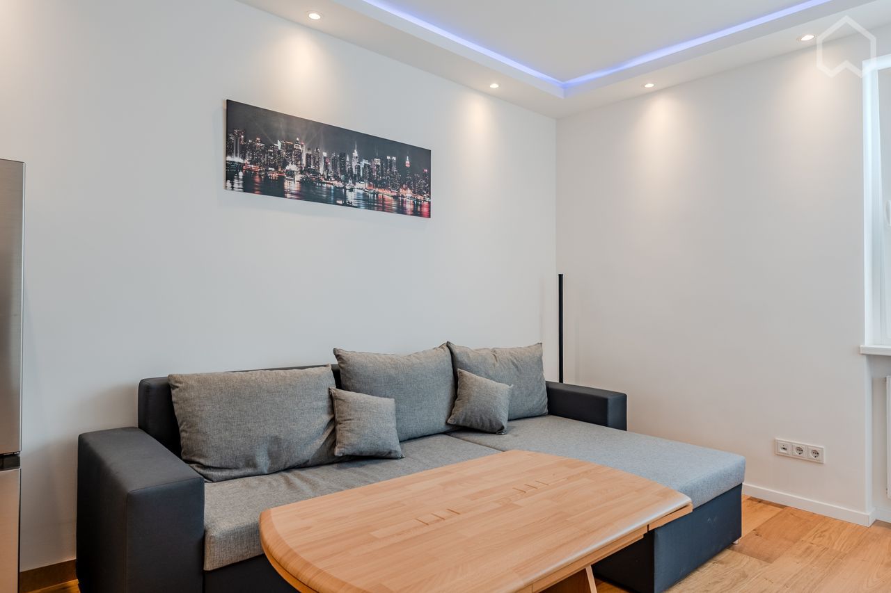 huge master bedroom with private balcony and working station in a high-end apartment