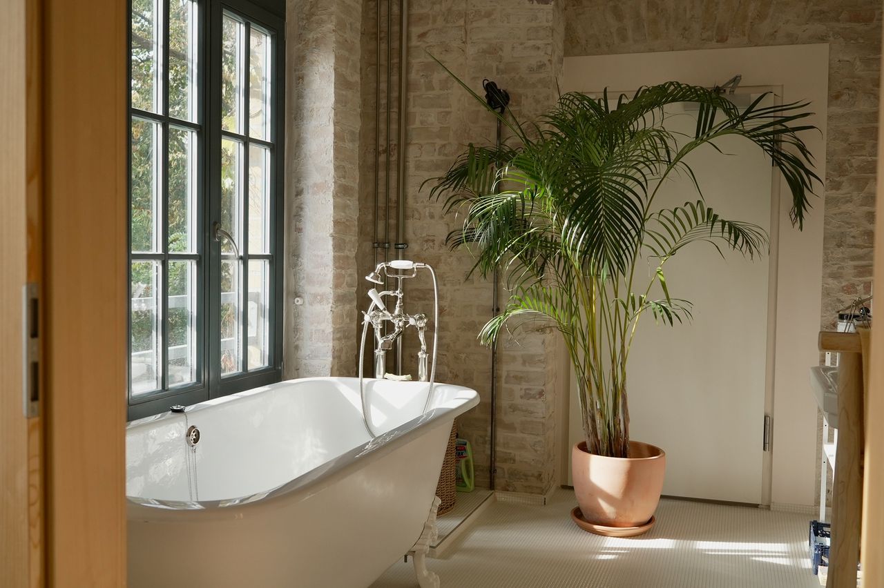 Bright loft in historic factory with oak floors and exposed brick walls