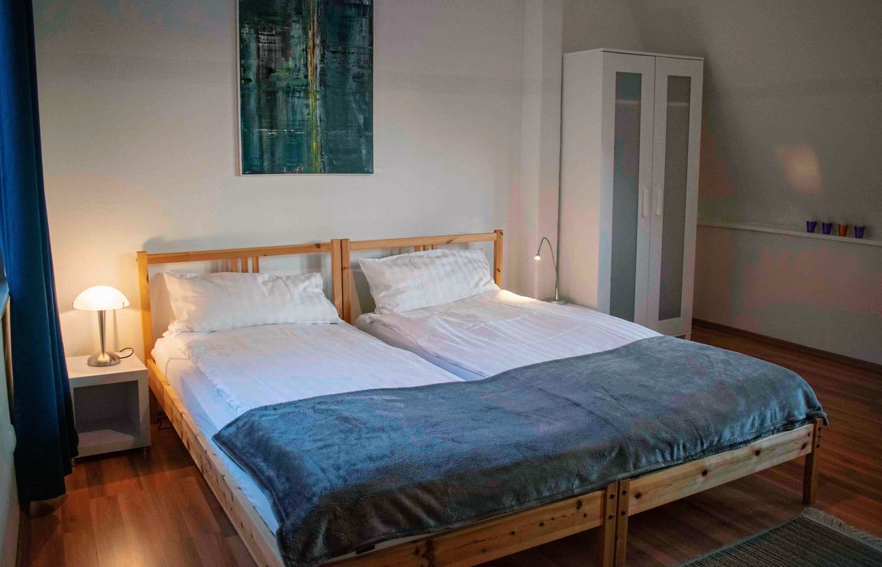 Room "Blaue Stube" with shared- bathrooms and kitchen in the historical "Sülfmeister Haus"