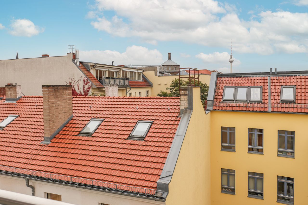 Great 2 room attic-business-apartment with a southwest facing balcony and viewing to the Alexander Tower at Kollwitzplatz