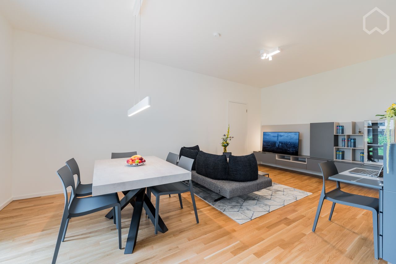 Luxurious living directly on the Spree: Modern 2-room apartment in Berlin Charlottenburg with partially covered terrace and spacious garden