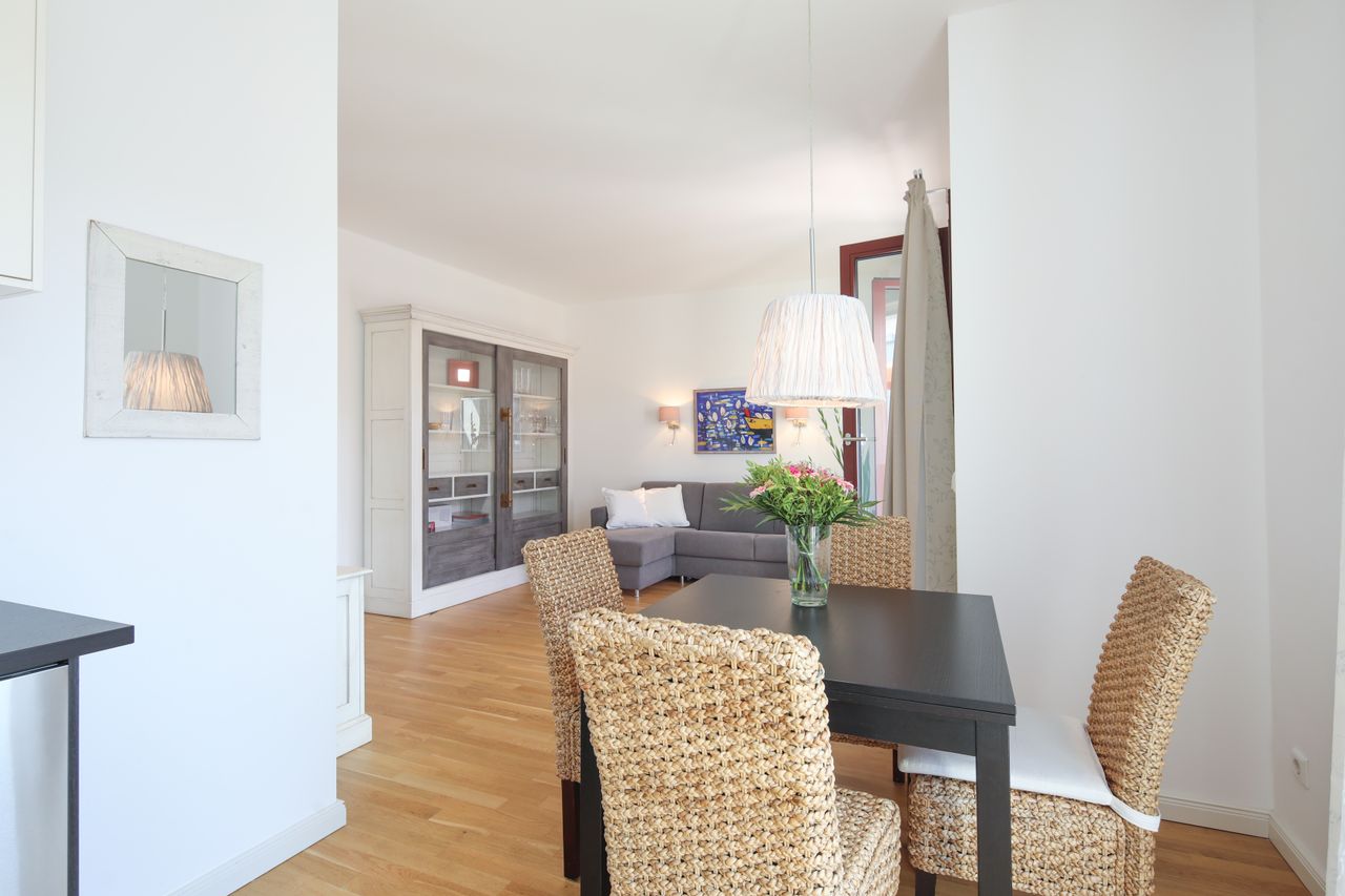 Sunny and modern 2-room penthouse in Berlin Mitte with roof terrace and underground parking space