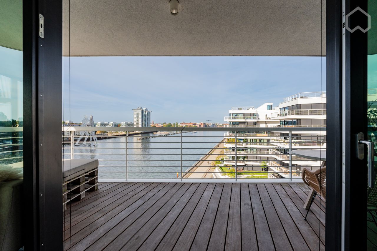 Wrap around water views in luminous luxury high-rise